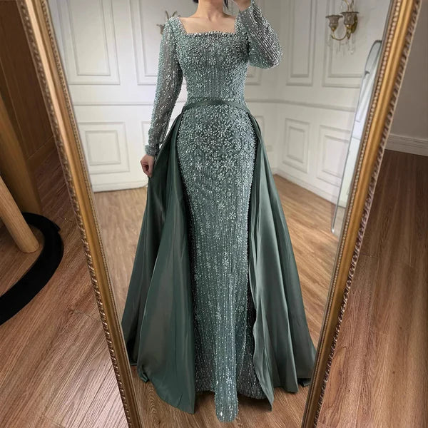 Woman wearing a sparkling green evening gown in front of a mirror.#2026 #bestonlineshop #missuniverse #besteveninggown #numberone #bestquality #top #eveningdress #mostpopular #cocktaildress #fittedeveningdress #cocktailparty #promdress #buynow #bridesmaid #weddingguestattire #styletrends #topfashion #weddingdress #bestclothingshop  #formaldress 