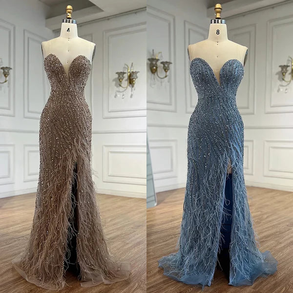 Woman wearing  champ formal evening gown  dress with a slit intricate beading, powder baby blue, feathered bottom, evening gown with a high slit, glitter sparkling diamonds, sweetheart neckline  v-neck, mermaid, train, old-money classy elegant dubai style, saudi arabic, sleeveless, elliesaab, prom, wedding guest, bridesmaid, mother of the bride, christmas, luxury, celebrity, expensive cheap, vintage, real photos, high-end, chooseone, viral, where to buy, now, shop, store, miss universe, best, number one top