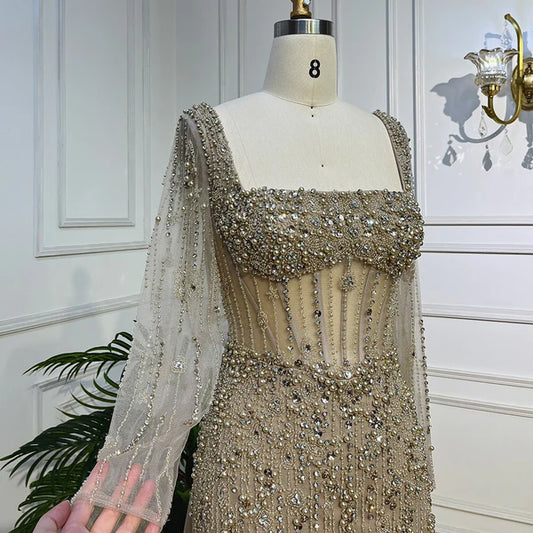 champagne nude cream skin color evening gown embellishments, formal evening dress intricate beading, glitter sparkling diamonds, square neckline, mermaid, train, old-money classy elegant dubai style, saudi arabic, long sleeves, saint laurent prom, wedding guest, bridesmaid, mother of the bride, christmas, luxury, celebrity, expensive cheap, vintage, real photos, high-end, choose one, viral, where to buy, 2026 shop, red carpet silk shein Prada Versace Cocktail applique quality mesh see-through Christian Dior