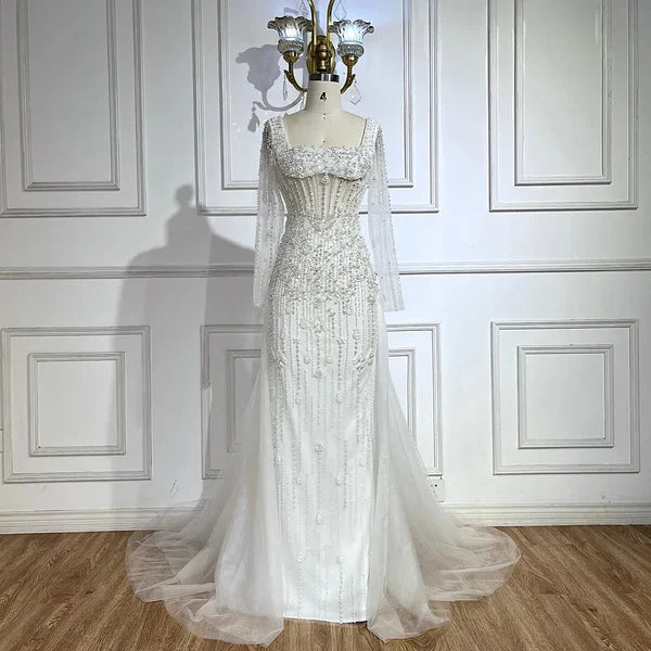 champagne nude cream skin white evening gown embellishments, formal evening dress intricate beading, glitter sparkling diamonds, square neckline, mermaid, train, old-money classy elegant dubai style, saudi arabic, long sleeves, saint laurent prom, wedding guest, bridesmaid, mother of the bride, christmas, luxury, celebrity, expensive cheap, vintage, real photos, high-end, choose one, viral, where to buy, 2026 shop, red carpet silk shein Prada Versace Cocktail applique quality mesh see-through Christian Dior