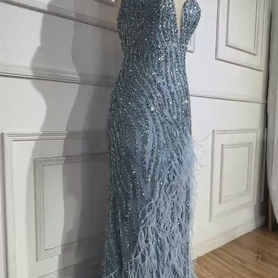 Woman wearing  blue formal evening gown  dress with a slit,intricate beading, powder baby blue, feathered bottom, evening gown with a high slit, glitter sparkling diamonds, sweetheart neckline  v-neck, mermaid, train, old-money classy elegant dubai style, saudi arabic, sleeveless, elliesaab, prom, wedding guest, bridesmaid, mother of the bride, christmas, luxury, celebrity, expensive cheap, vintage, real photos, high-end, chooseone, viral, where to buy, now, shop, store, miss universe, best, number one top